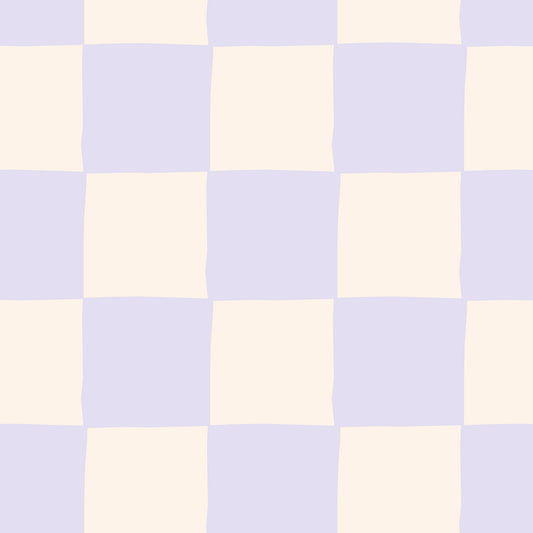 Maßangefertigte Vliestapete mit großem Karo-Muster in Blau und Beige neben gelber Tür im hellen Raum.