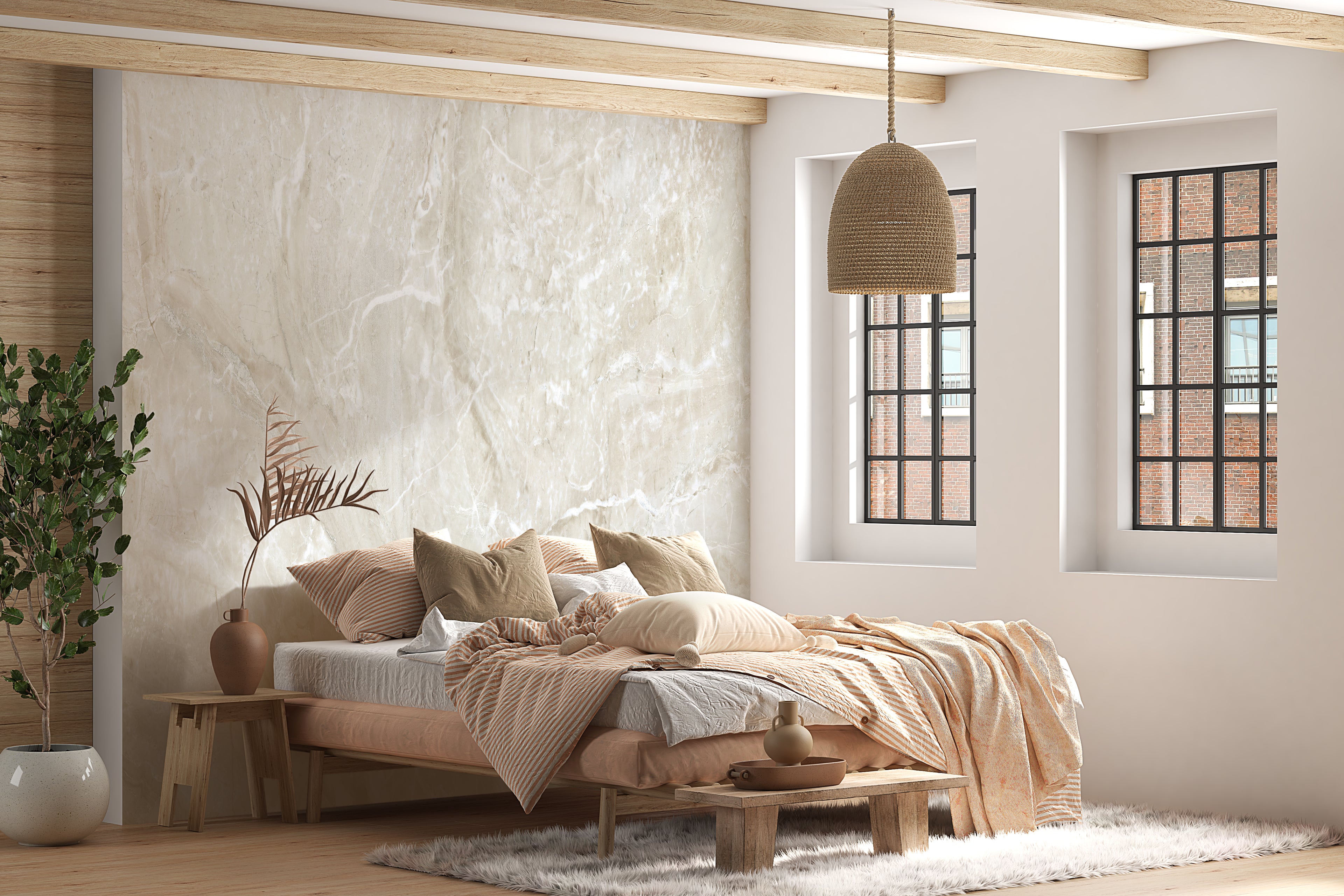 Ansicht eines Schlafzimmers in beigetönen mit beiger Fototapete an der Wand in Marmor-Optik.