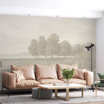 Maßangefertigte Vliestapete mit pastellfarbener Landschaft und Bäumen im dezenten Vintage-Stil im Wohnzimmer.