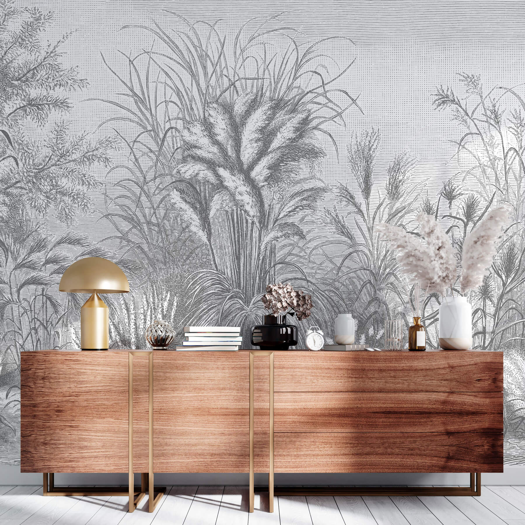 Fototapete mit schwarz-weißem Gräsermuster im Holzschnitt-Stil. Davor steht eine braune Kommode.